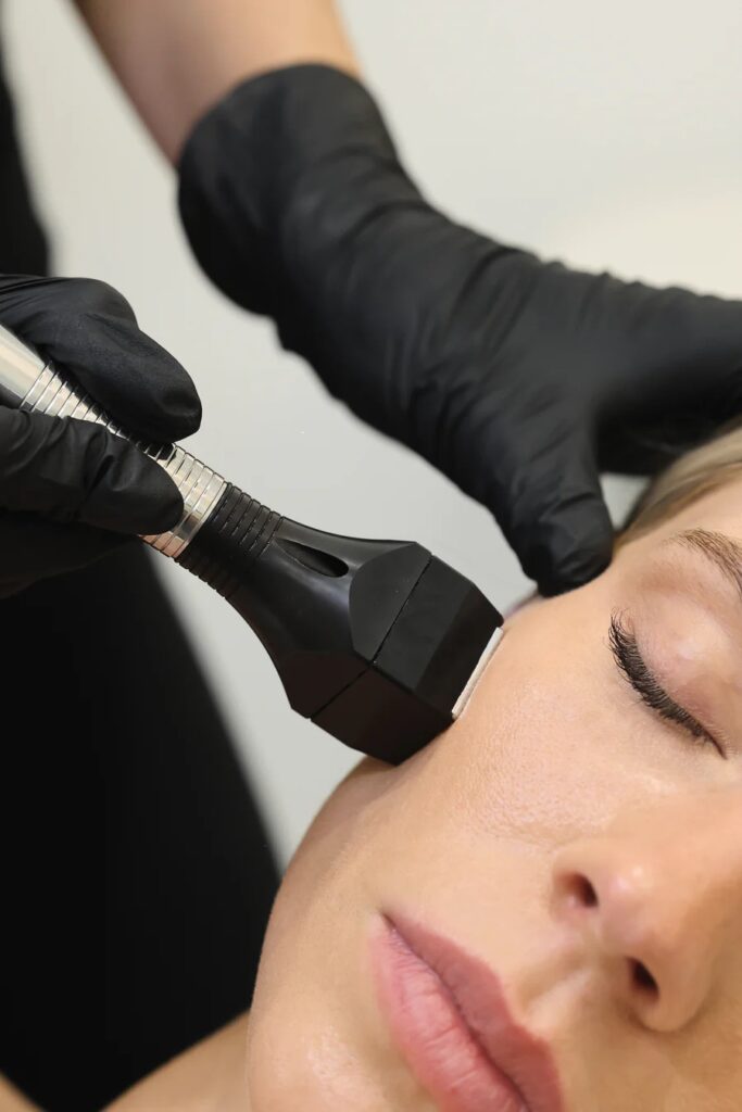 Woman getting facial forma treatment facial skin tightening