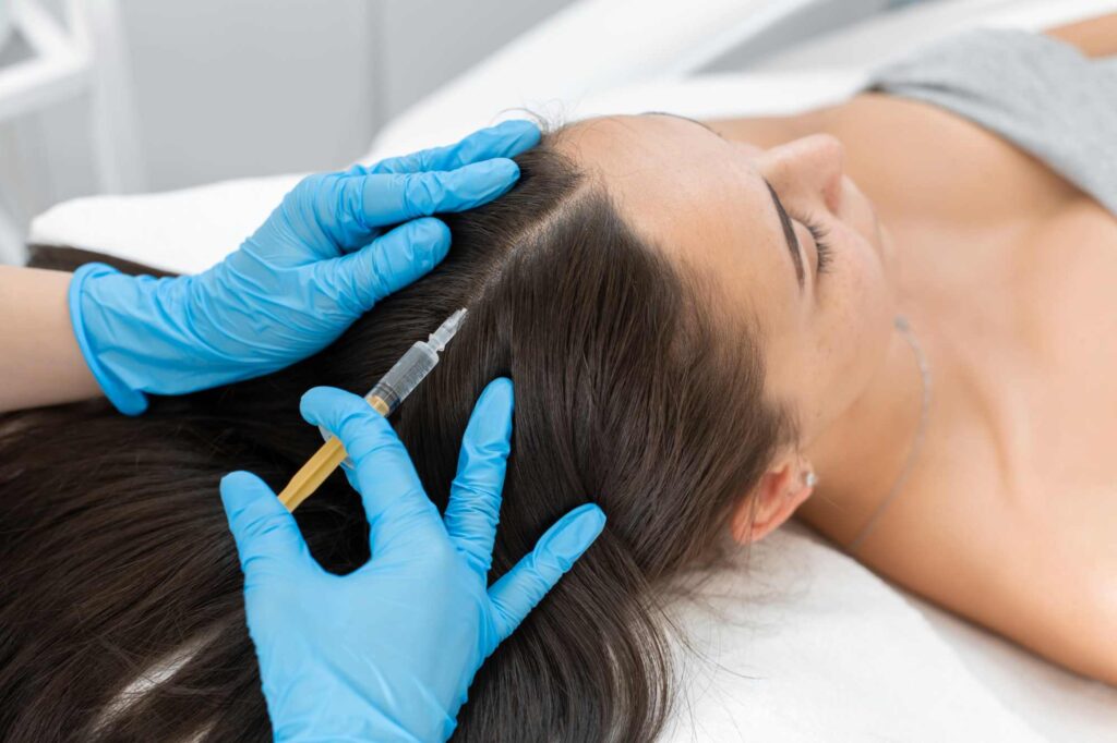 Woman getting hair growth PRP injections