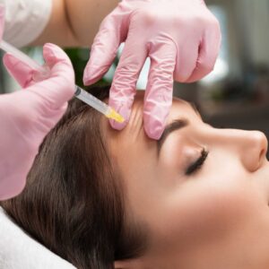 Provider administering Jeuveau injections to soften facial expression lines at Ever Medical Spa in Canton, Michigan